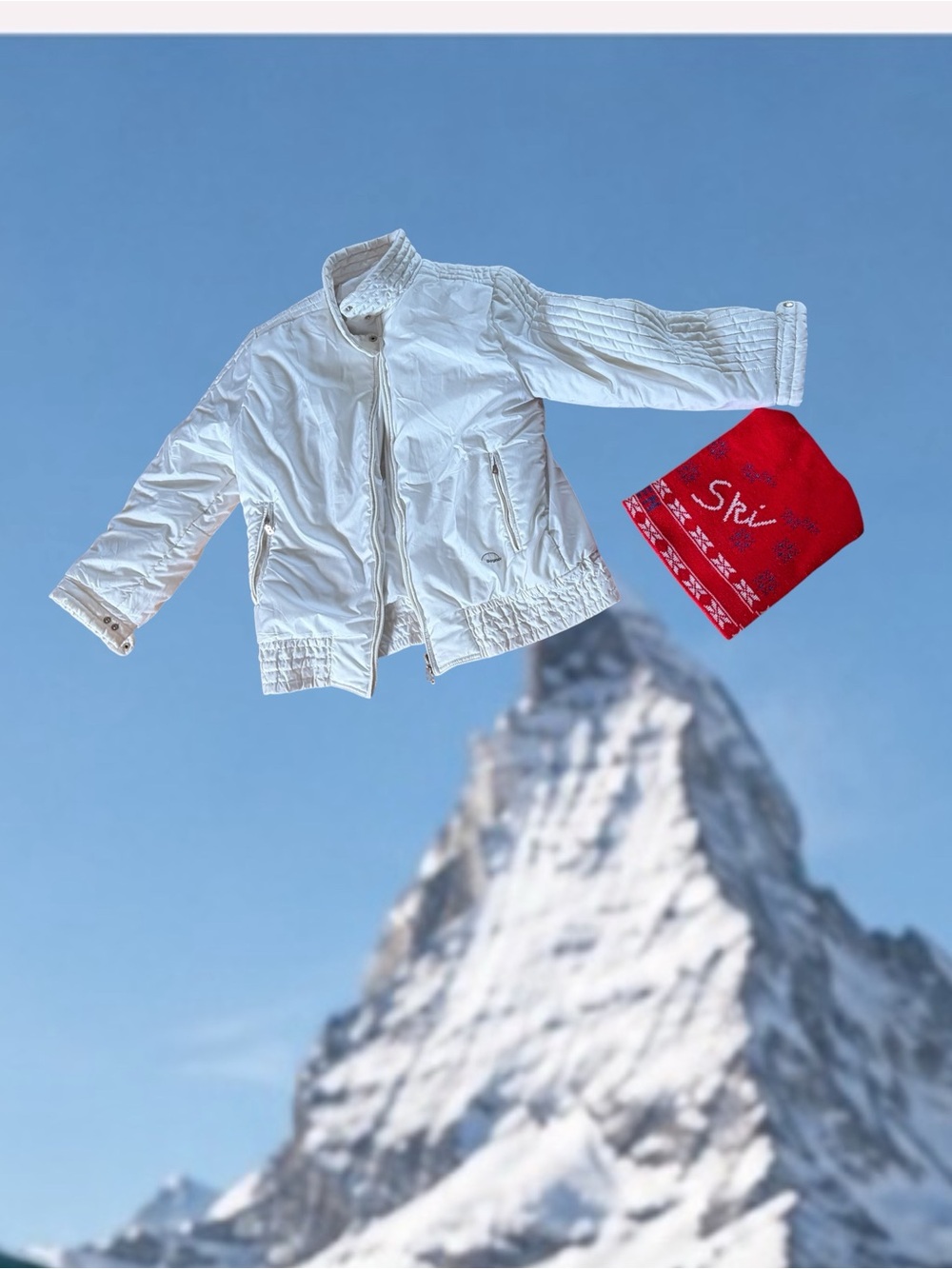 Bogner White Ski Jacket with Red Beanie